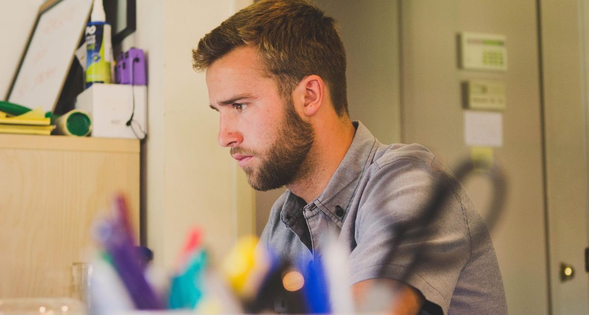 Man, work, desk — MetaTrader on iOS for Fast and Reliable Trading